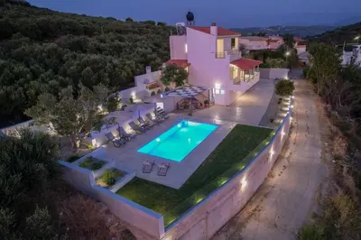 an aerial view of a house with a swimming pool at Olea Retreat Villa in Yerakianá