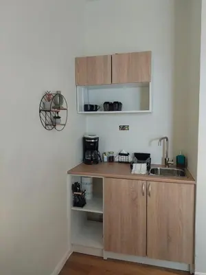 a kitchen with a sink and a counter top at Chavalon Apartments in Kalyves