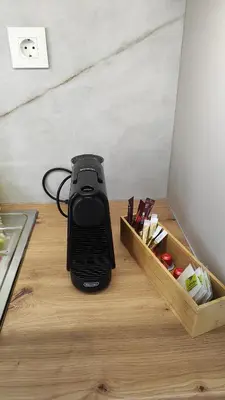 a black cooker sitting on a counter next to a drawer at Dabia Escape in Chania Old Town in Chania Town