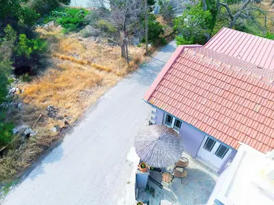 an aerial view of a house with a red roof at Suites Near Elafonisi in Élos
