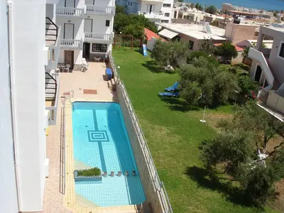 an aerial view of a swimming pool on a building at Popi Hotel Apartments in Agia Marina Nea Kydonias