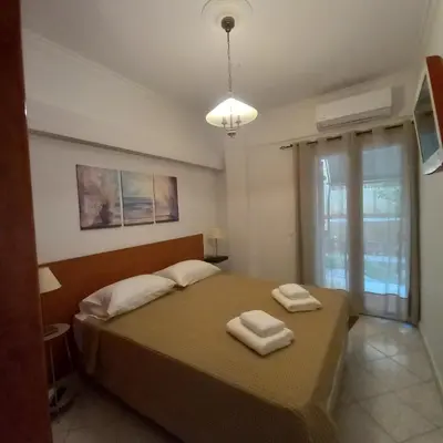 a bedroom with a bed with two towels on it at Kornaros House in Chania Town