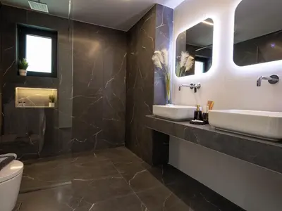 a bathroom with two sinks and a mirror at PanStel Twin Villas with private pools and jacuzzi in Ayiá