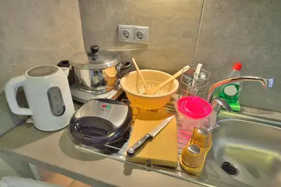 a kitchen counter with a sink and a counter top with a counter top at Callista sea view or garden in Kissamos