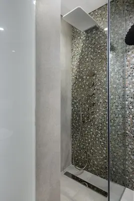 a bathroom with a shower with a glass door at Ionas Boutique Hotel in Chania Town