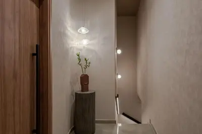 a hallway with a potted plant on a table at Amara Luxury Suites With Private Hot Tub in Chania Town