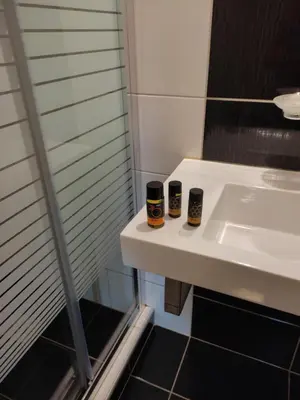a bathroom with a sink and two cups on it at Casa Di Porto in Chania Town