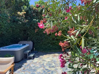a garden with a hot tub and some flowers at Elafonisi Manor with Private Pool & Jaccuzi in Perivólia