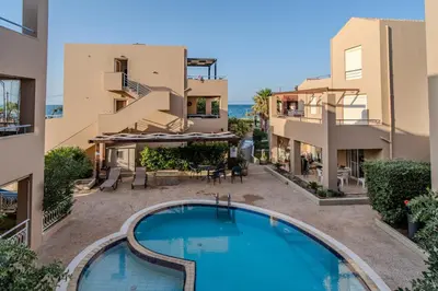 an apartment with a swimming pool in a building at Helena's Dream Home in Maleme