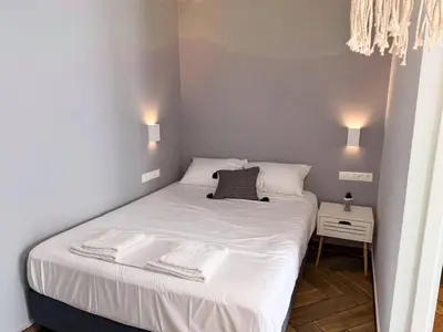 a bedroom with a bed with two towels on it at Amfitriti 30meter to beach, 6min Old Town, 2BD 4PL in Chania Town