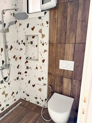a bathroom with a toilet and a shower at Amfitriti 30meter to beach, 6min Old Town, 2BD 4PL in Chania Town