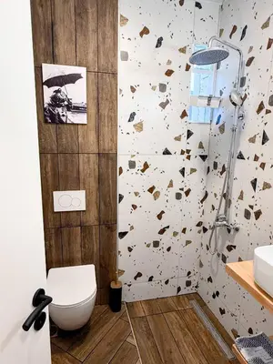 a bathroom with a toilet and a sink at Amfitriti 30meter to beach, 6min Old Town, 2BD 4PL in Chania Town