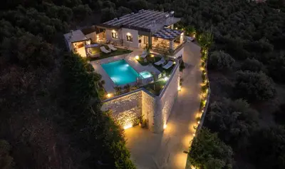 an overhead view of a house with a swimming pool at Villa Lady Dafni with private heated pool in Maleme