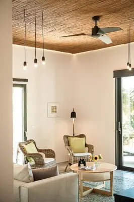 a living room with a couch and a table at Myrtia Beach House in Tersanas