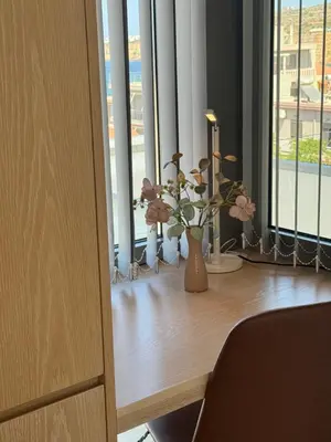 a room with a table with vases and flowers on it at Alky Luxury Villa in Chania Town