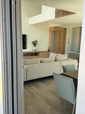 a living room with a couch and a table at Alky Luxury Villa in Chania Town