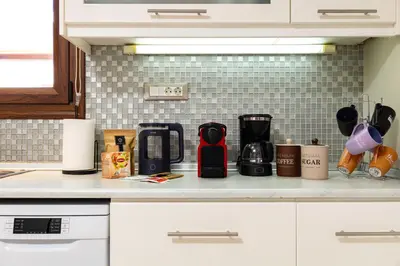 a kitchen counter with a coffee maker on it at Harbour - Spacious Unique 2-Balcony Apartment in Chania Old Town in Chania Town