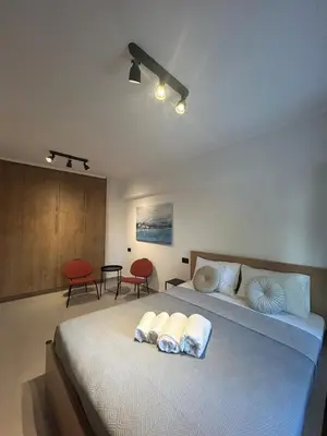 a bedroom with a large bed with two pillows on it at A&G mare in Chania Town