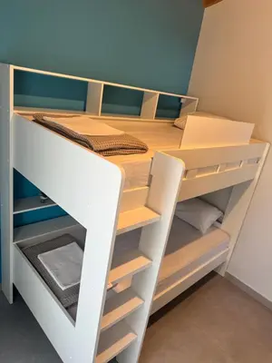 a bunk bed with a desk in a room at Matthew's house in Kalamítsion Alexándrou