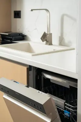 a dishwasher under a sink in a kitchen at Ethea Residences-Orino in Chania Town
