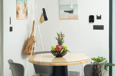 a table with a bowl of fruit on top of it at Ethea Residences-Orino in Chania Town