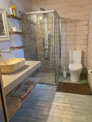 a bathroom with a shower and a sink and a toilet at La Irilia Residences & Retreat in Agios Padeleimon
