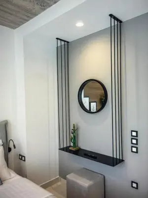 a bedroom with a mirror on the wall at Amazing views in Chania Town