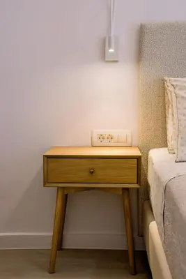 a wooden table next to a bed in a room at Terra Chic Retreat Suite in Chania Town