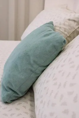 a blue pillow sitting on top of a bed at Terra Chic Retreat Suite in Chania Town