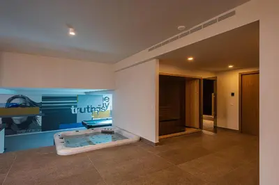 a bathroom with a jacuzzi tub in a room at Only View Villa - Timeless Coastal Retreat by etouri in Chania