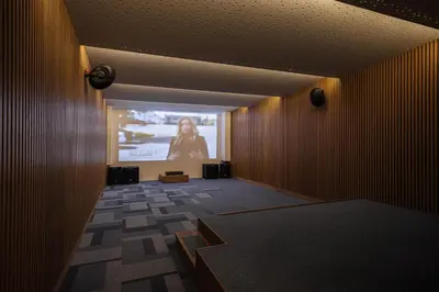 a room with a projection screen in a building at Only View Villa - Timeless Coastal Retreat by etouri in Chania