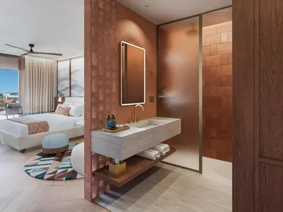 a bathroom with a sink and a bed and a mirror at Hilton Chania Old Town Resort & Spa in Chania Town