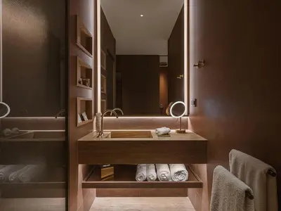 a bathroom with a sink and a mirror at Hilton Chania Old Town Resort & Spa in Chania Town