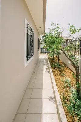 a corridor of a house with a white wall at Creta Sea View 2BR Maisonette by ΜΡS in Marathokefála
