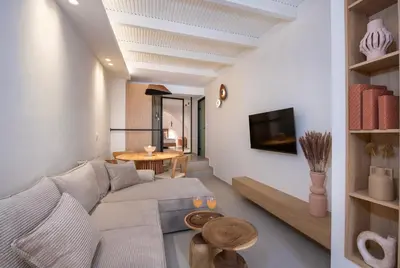 a living room with a couch and a table at Bōw Ground Floor Luxury Apt-In Chania Old Town! in Chania Town