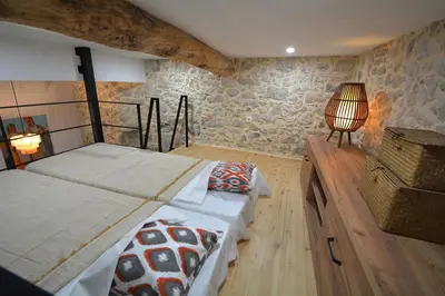 a bedroom with two beds and a lamp in it at Agapi in Kissamos
