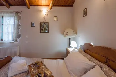 a bedroom with a bed and a window at Maria's Serene Countryside Retreat in Chania Town