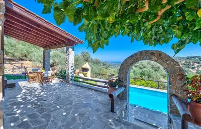 a villa with a pool and a view at Villa Olive Xrisi in Kafoúros