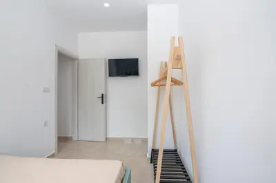 a room with a ladder next to a bed at Huzuri Retreat in Kissamos
