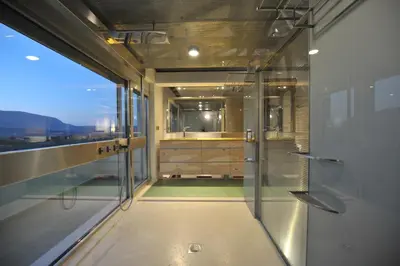 a bathroom with a shower and a glass door at The Architect's House in Neo Chorio in Néon Khoríon