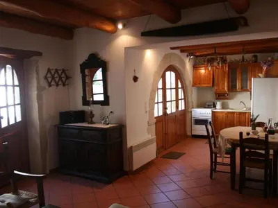a kitchen with an archway and a table in a room at Holiday Home in Douliana mit Großem Balkon by Interhome in Douliana