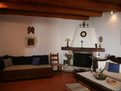 a living room with a couch and a fireplace at Holiday Home in Douliana mit Großem Balkon by Interhome in Douliana
