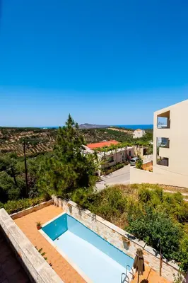 a swimming pool on the roof of a house at Villa Eftichia in Stalos