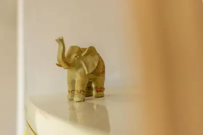a small elephant standing on top of a table at Cozy Apartment Next To The Beach In Almyrida -BY APOKORONAS VILLAS in Almirida