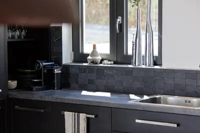 a kitchen counter with a sink and a window at Villa EsHi w Private Pool & Scenic Sea View in Kalyves