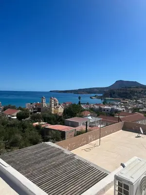 a view of the ocean from the roof of a building at Azure Sea Bliss at The Erodios Apartments in Kalyves