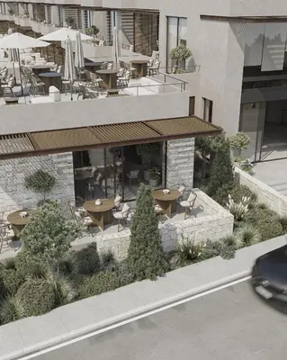 an outdoor patio with tables and chairs in a building at Okeanis Elysium in Daratso