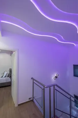 a room with a purple ceiling with a staircase at Adriana Horizon Villa, Pool & Hillside View in Galatás