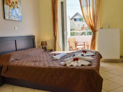 a bedroom with a bed with towels on it at Apartment Charmante Ferienwohnung Rubini 2 by Interhome in Agia Marina Nea Kydonias