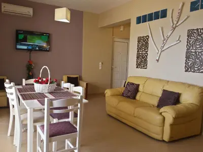 a living room with a couch and a table at Apartment Rubini 1 by Interhome in Agia Marina Nea Kydonias